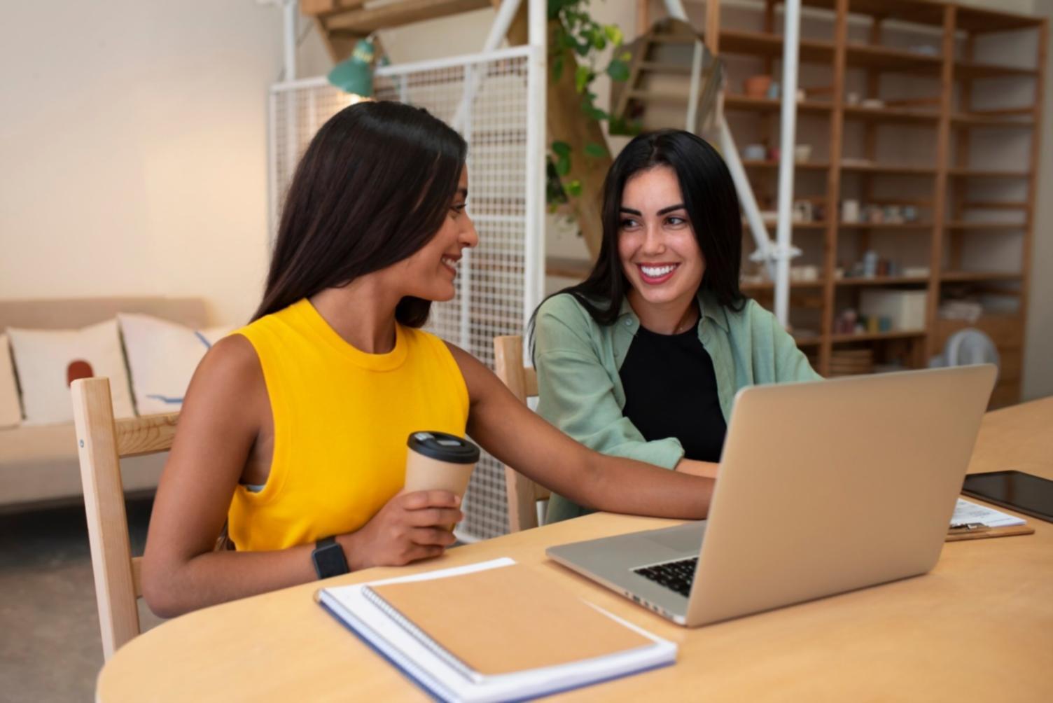 Two people reviewing financial documents together at a table